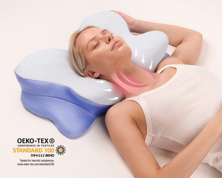 Woman asleep on a contoured cervical pillow supporting her neck